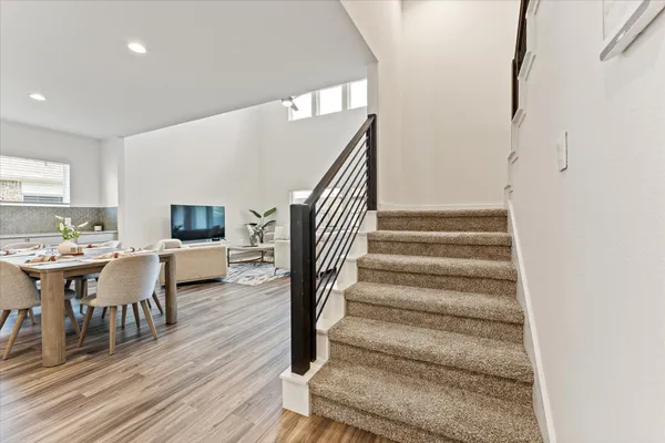 a view of entryway and hall with wooden floor