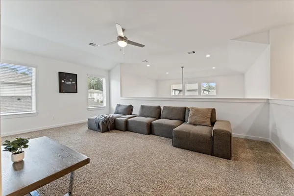 a living room with furniture and a window