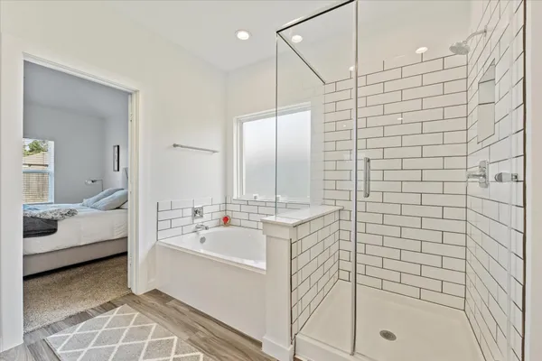 a bathroom with a bathtub and a sink
