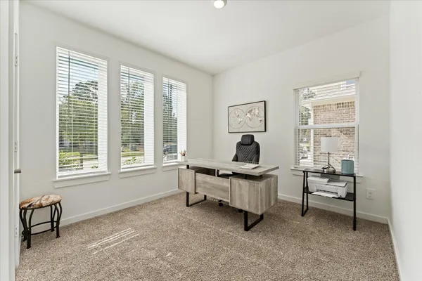 a work room with furniture and windows