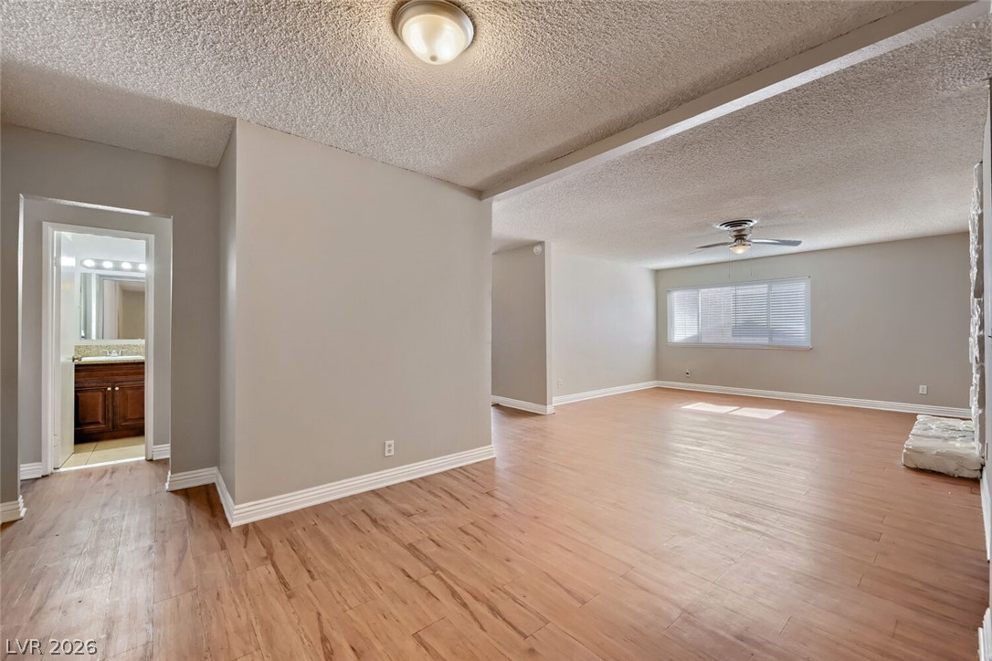6321 Portola Road Las Vegas, NV 89108 - Photo 29 of 29 An open floorplan with natural light streaming through the wide window, featuring durable flooring.