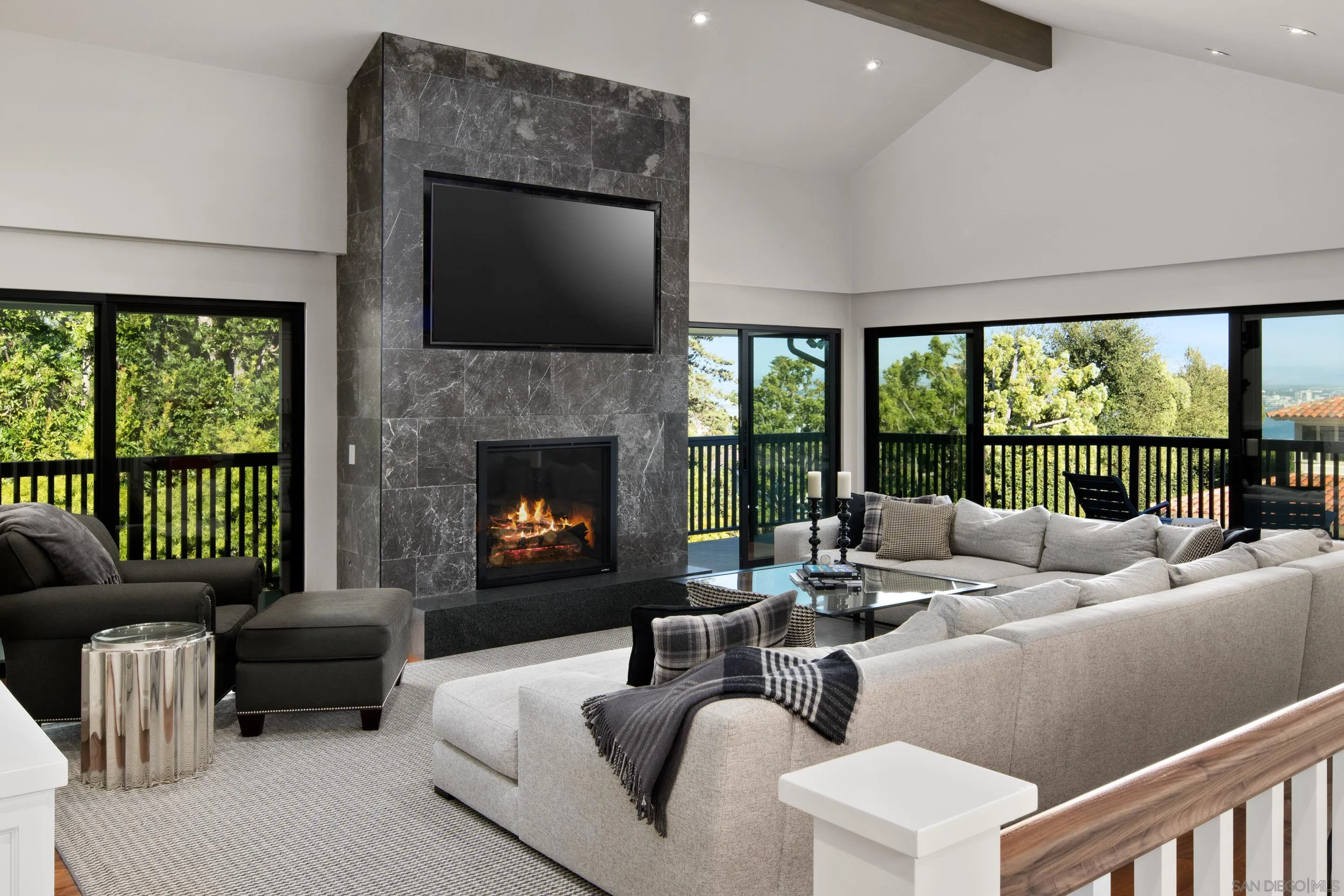 3530 Silvergate Place San Diego, CA 92106 - Photo 15 of 41 a living room with furniture fireplace and a large window