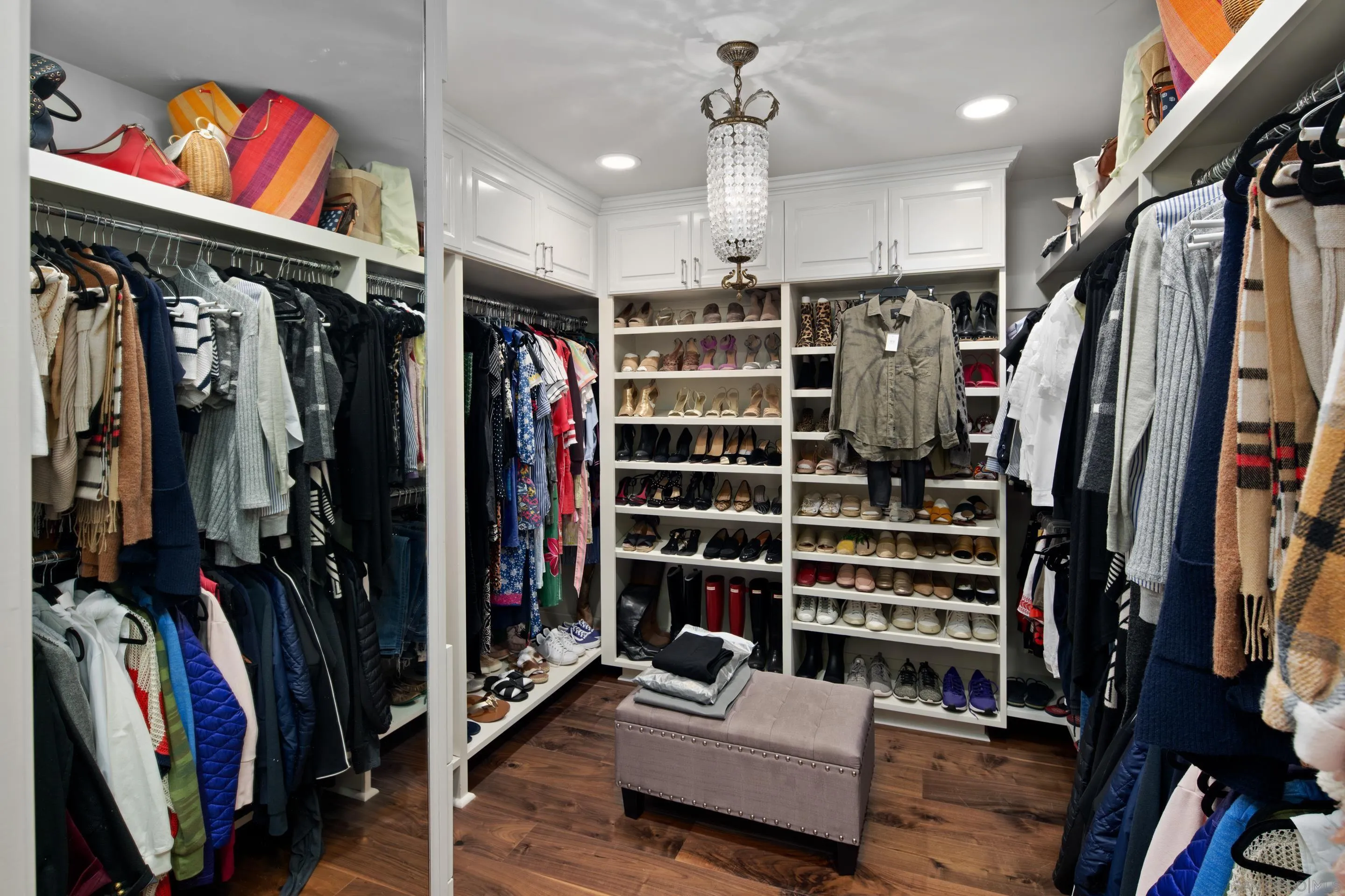 3530 Silvergate Place San Diego, CA 92106 - Photo 22 of 41 a view of walk in closet with clothes and shoes