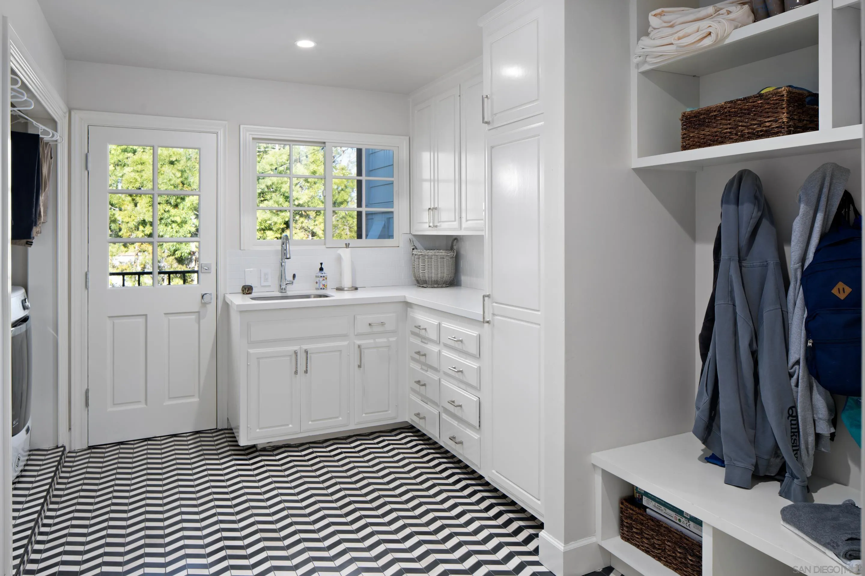 3530 Silvergate Place San Diego, CA 92106 - Photo 30 of 41 a kitchen with a sink cabinets and a window