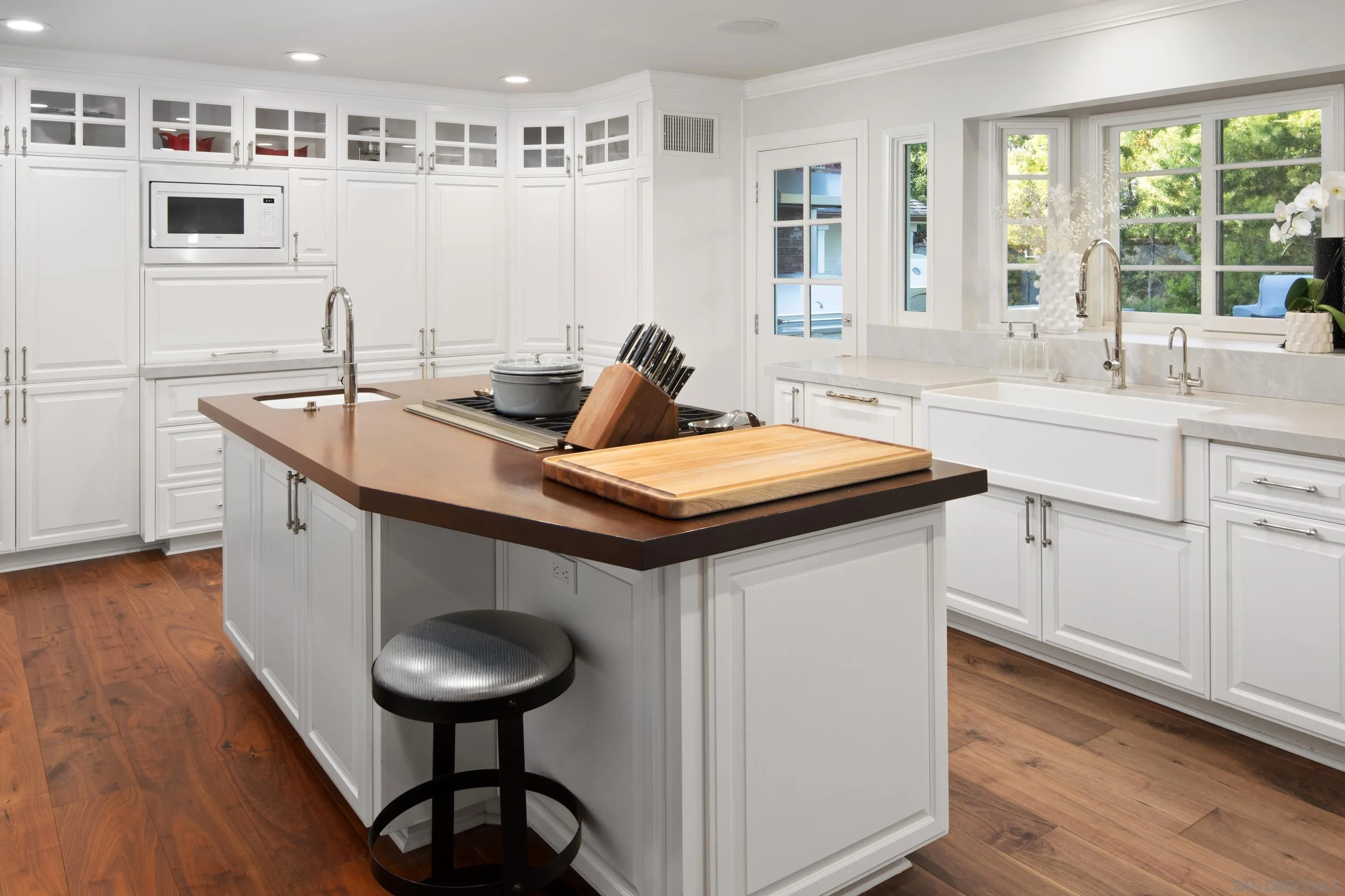 3530 Silvergate Place San Diego, CA 92106 - Photo 5 of 41 a kitchen with a sink and wooden cabinets