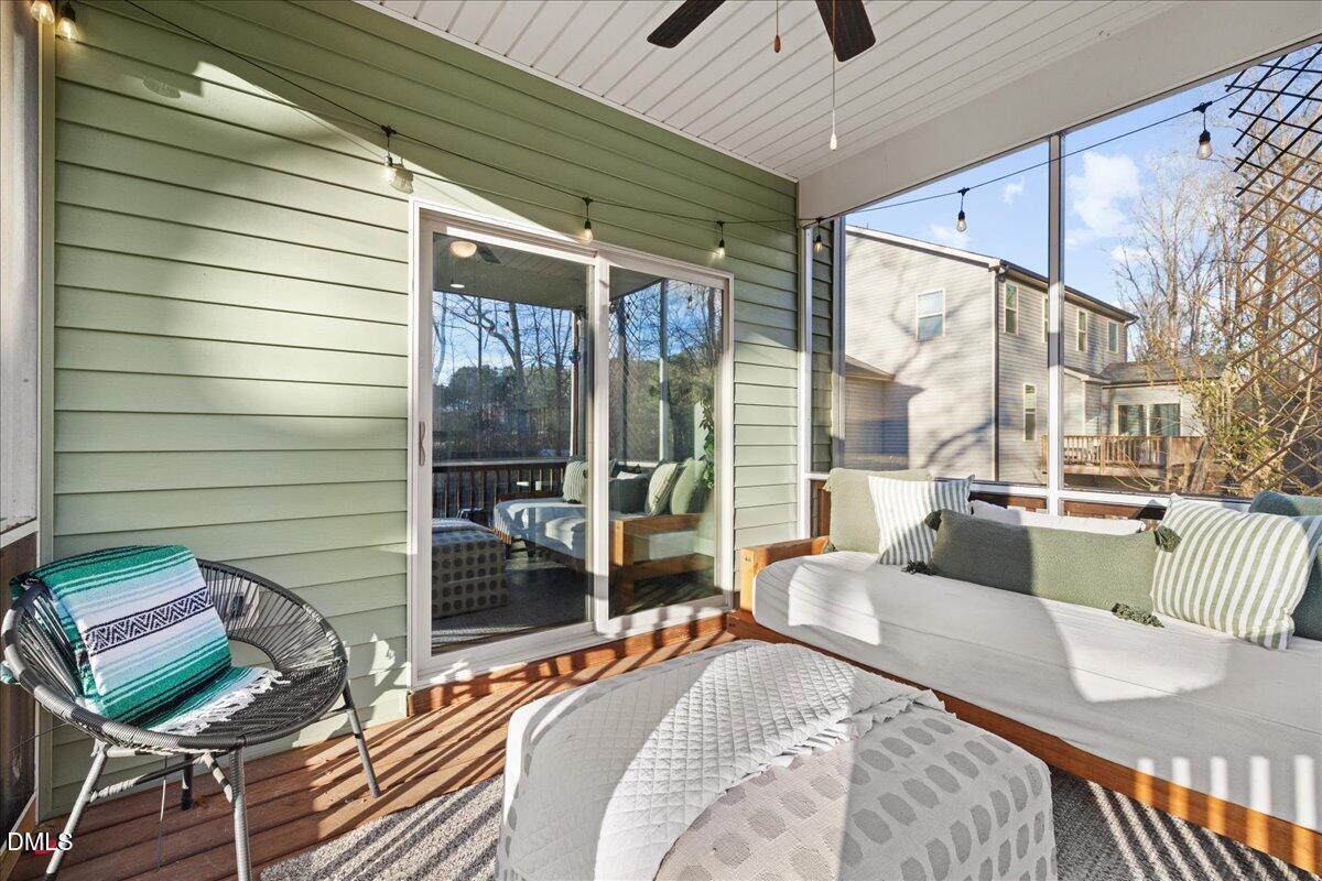 7804 Charters End Street Willow Spring, NC 27592 - Photo 37 of 43 a balcony with furniture and a large window