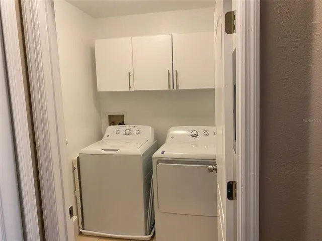 a bathroom with a sink a mirror and a shower