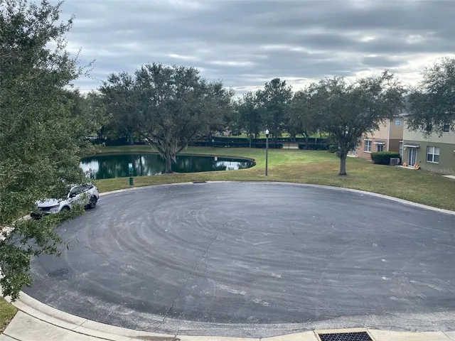 a view of a swimming pool with chairs
