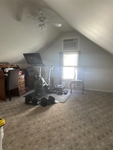 a room with gym equipment and a window