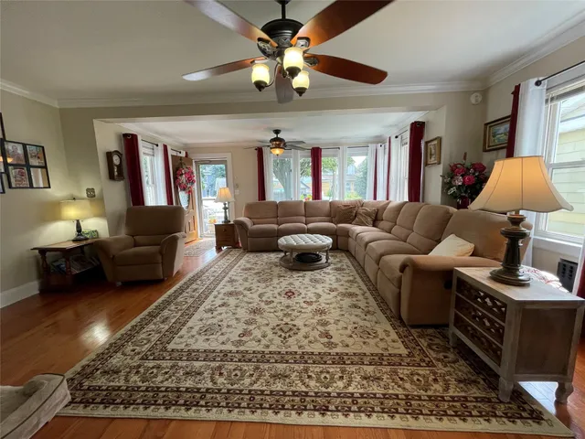 a living room with furniture and a rug