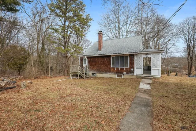 a house with trees in the background