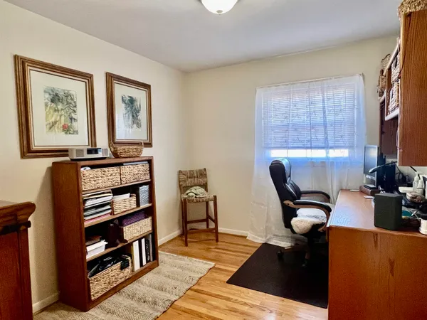 a view of a workspace with furniture and toys