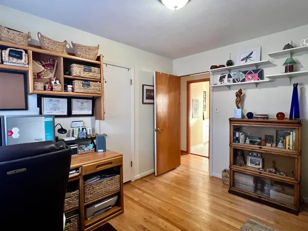 a workspace with furniture and window