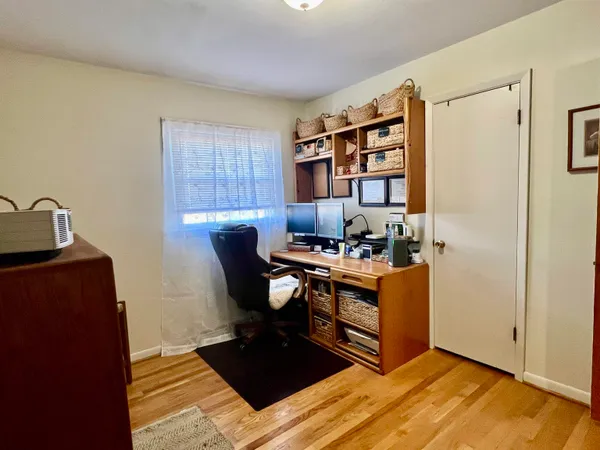 a bathroom with a toilet and a shower curtain
