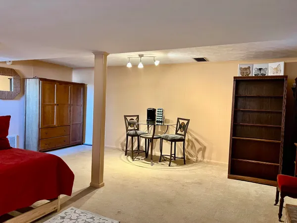 a view of kitchen with cabinets