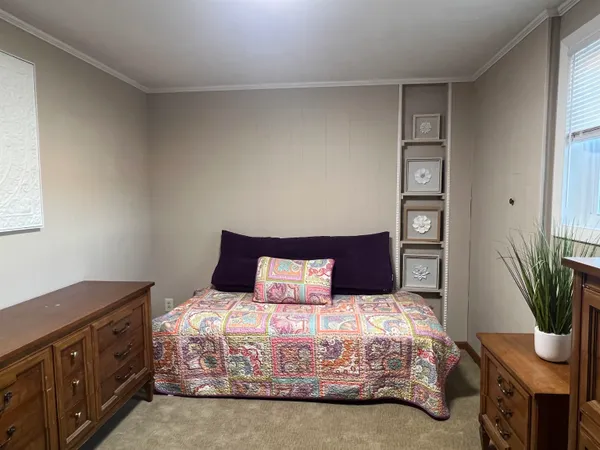 a bedroom with a bed and cabinets