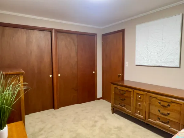 a bathroom with a granite countertop toilet and a sink