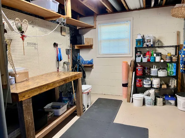 a view of a backyard with furniture and a garden