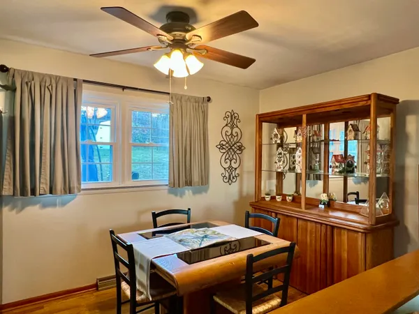 a view of a dining room with furniture window and outside view