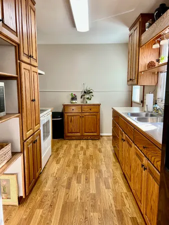 a kitchen with stainless steel appliances granite countertop a stove and a refrigerator