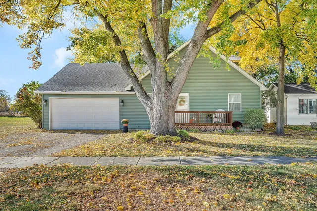 a house that has a tree in front of it