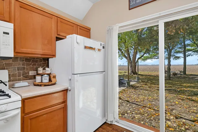a white refrigerator freezer sitting inside of a kitchen