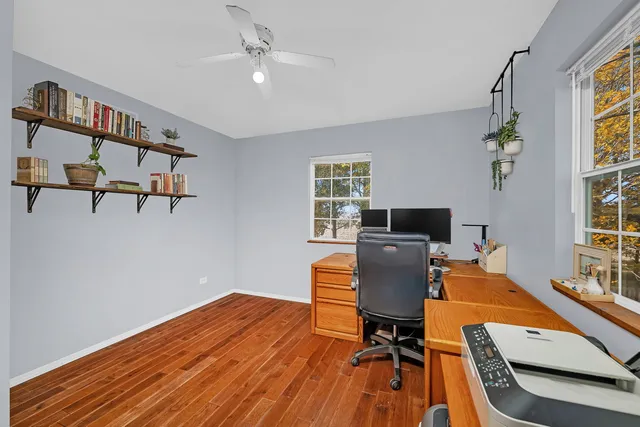 a workspace with furniture hardwood and a window