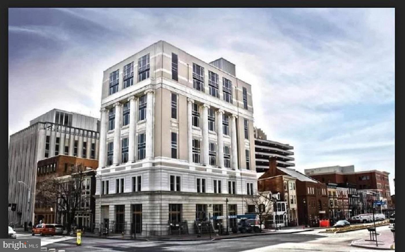 231 State Street, Unit 802 Harrisburg, PA 17101 - Photo 1 of 27 a front view of a building with lot of cars and trees