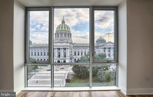 a view of a room with a floor to ceiling window