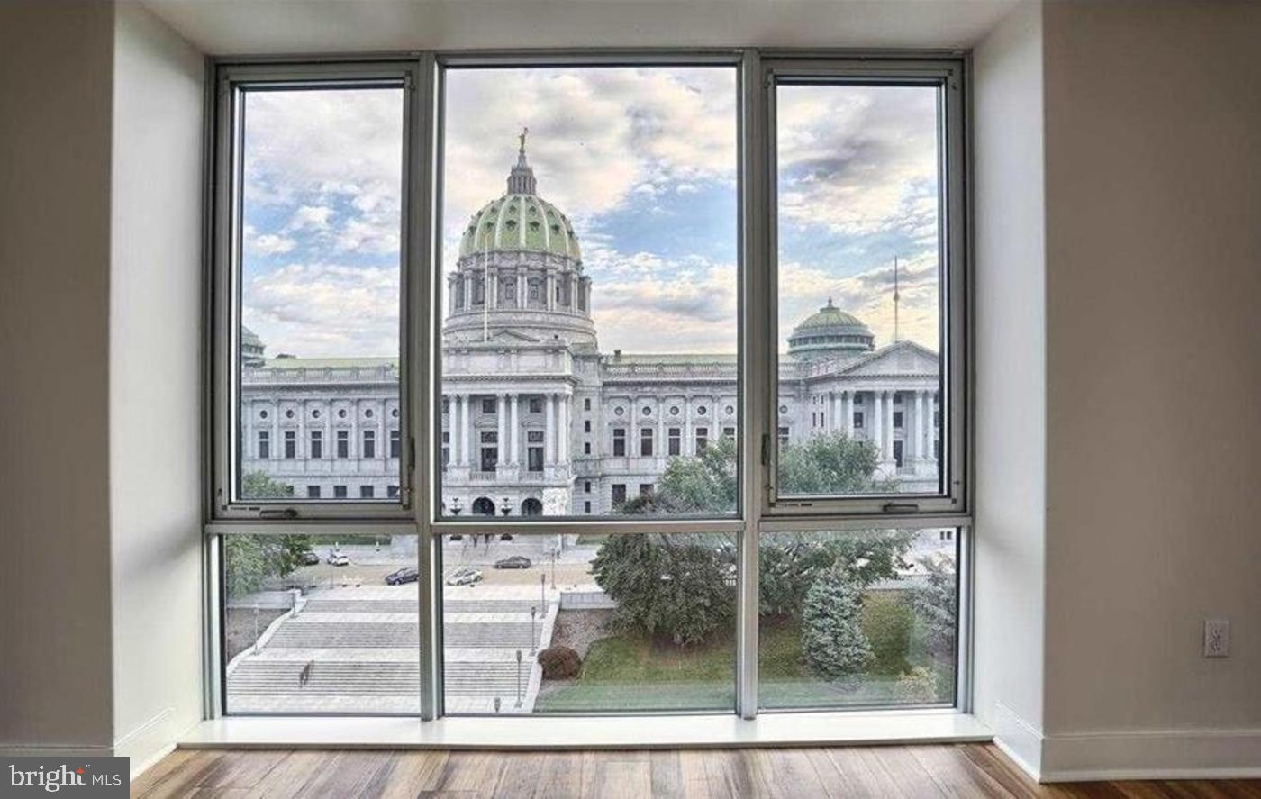 231 State Street, Unit 802 Harrisburg, PA 17101 - Photo 11 of 27 a view of a room with a floor to ceiling window