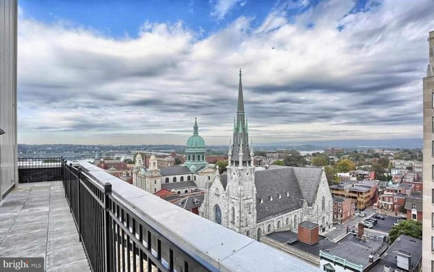 231 State Street, Unit 802 Harrisburg, PA 17101 - Photo 13 of 27 a view of a balcony with wooden floor