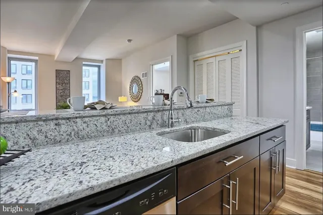 a kitchen with a sink and cabinets