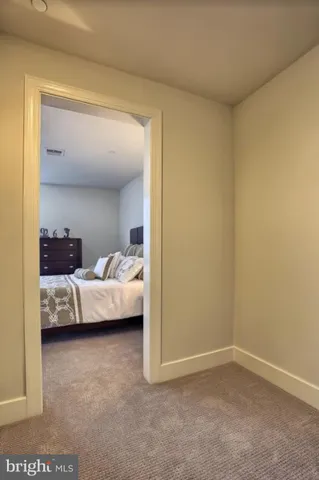a bedroom with a bed and a view of bedroom