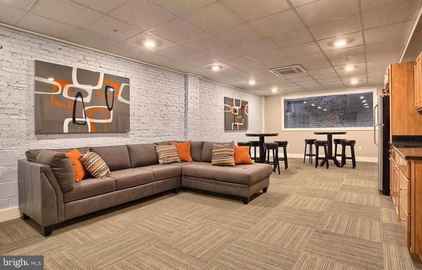 231 State Street, Unit 802 Harrisburg, PA 17101 - Photo 24 of 27 a living room with furniture and a large window
