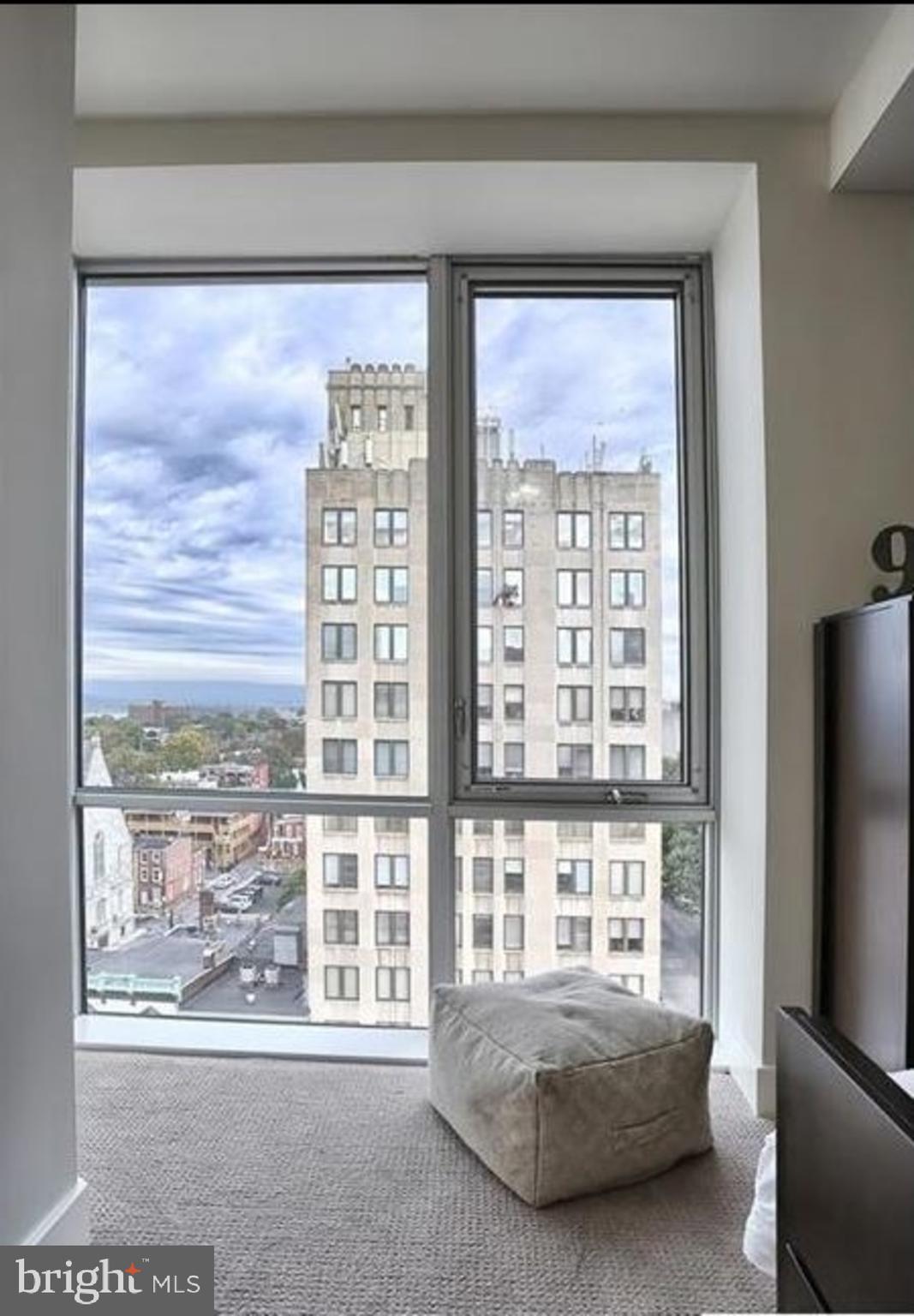 231 State Street, Unit 802 Harrisburg, PA 17101 - Photo 9 of 27 a bedroom with furniture and a window