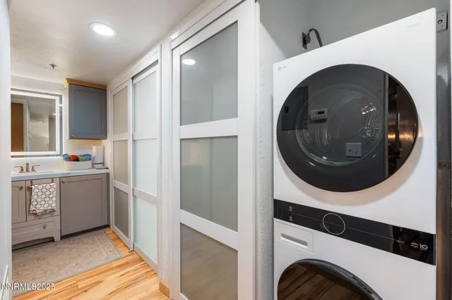 a en suite bathroom with a sink double vanity and a mirror