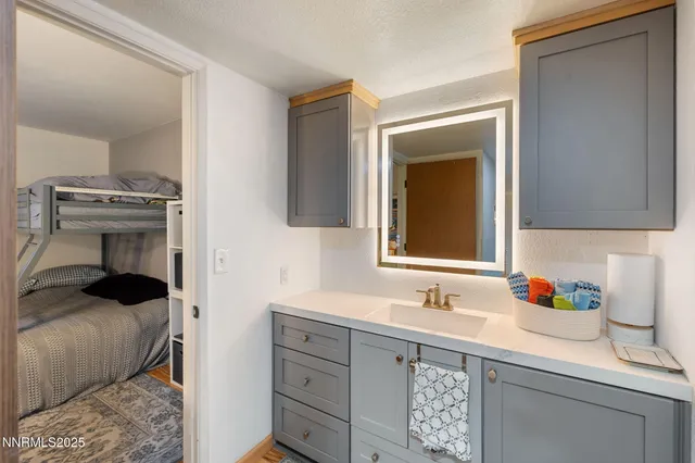 a bedroom with a bed and a chair