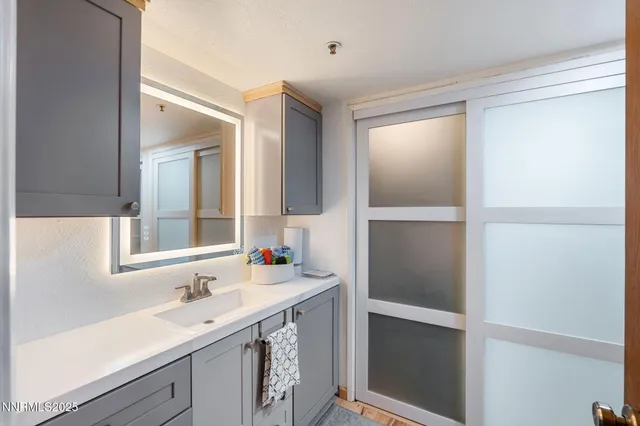 a bathroom with a sink and a mirror