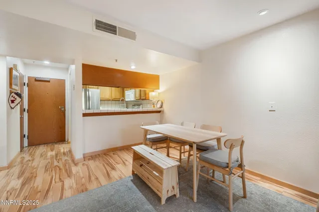 a room with a table and chairs