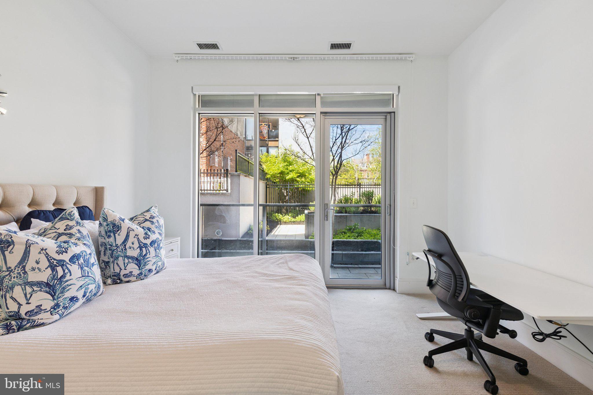 410 South Front Street, Unit 108 Philadelphia, PA 19147 - Photo 13 of 34 a bedroom with furniture and a window