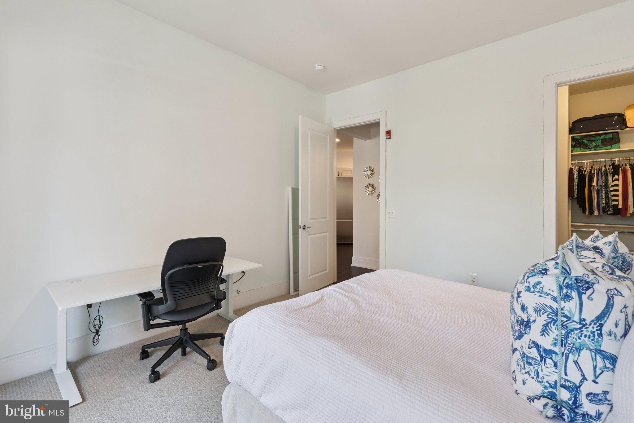 410 South Front Street, Unit 108 Philadelphia, PA 19147 - Photo 15 of 34 a bedroom with a bed and a workspace