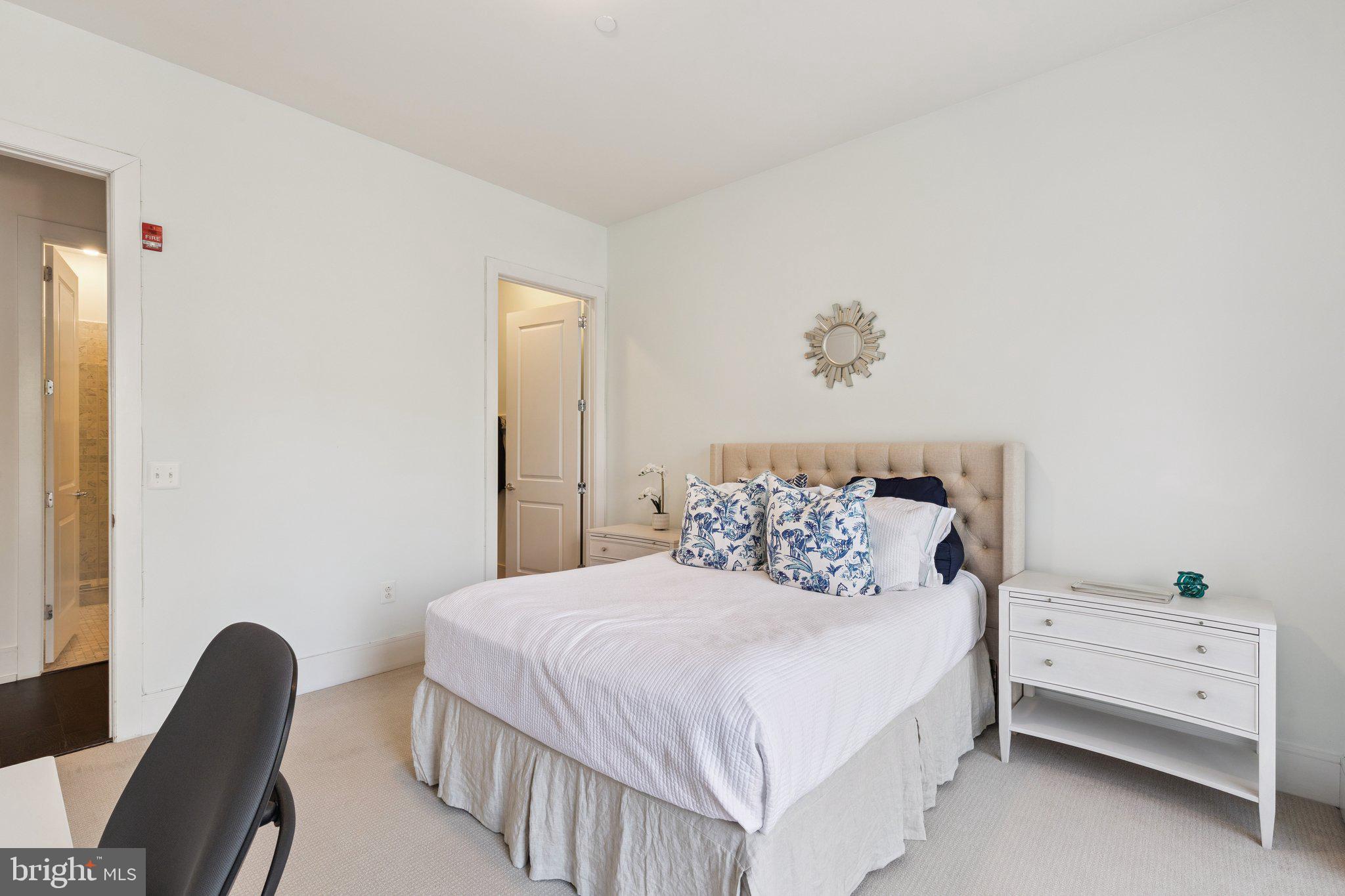 410 South Front Street, Unit 108 Philadelphia, PA 19147 - Photo 16 of 34 a bedroom with a bed and a chair