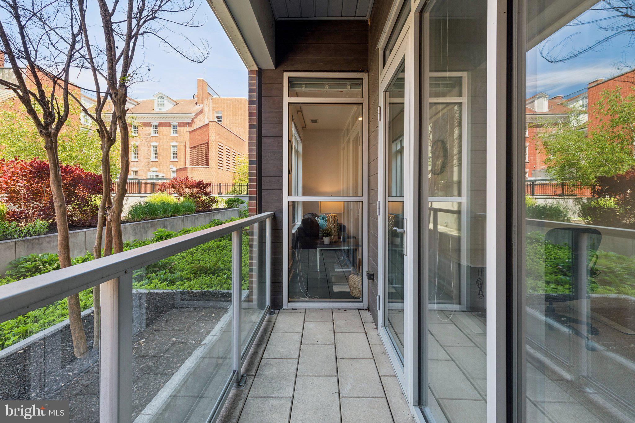 410 South Front Street, Unit 108 Philadelphia, PA 19147 - Photo 19 of 34 a view of a glass door with a balcony