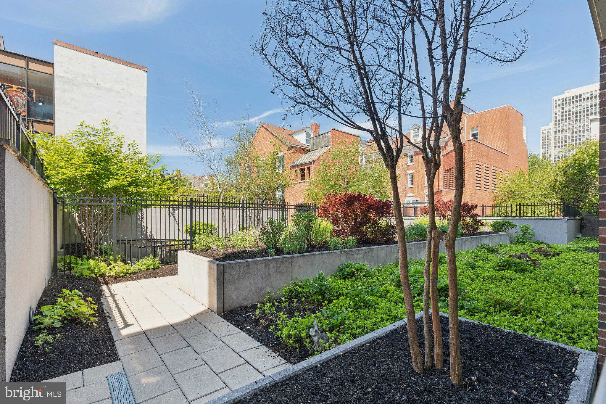 410 South Front Street, Unit 108 Philadelphia, PA 19147 - Photo 21 of 34 a view of a pathway with a garden
