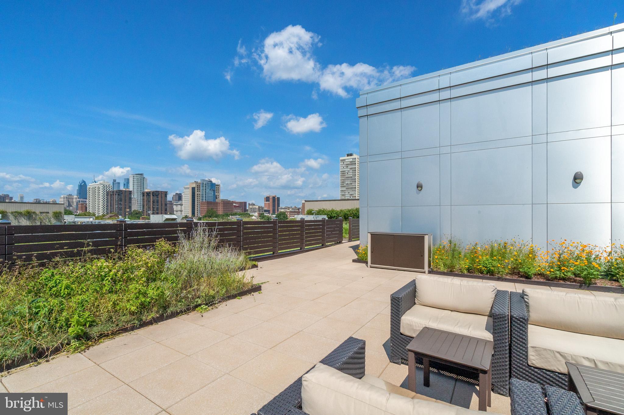 410 South Front Street, Unit 108 Philadelphia, PA 19147 - Photo 26 of 34 a view of a terrace with couches and a table