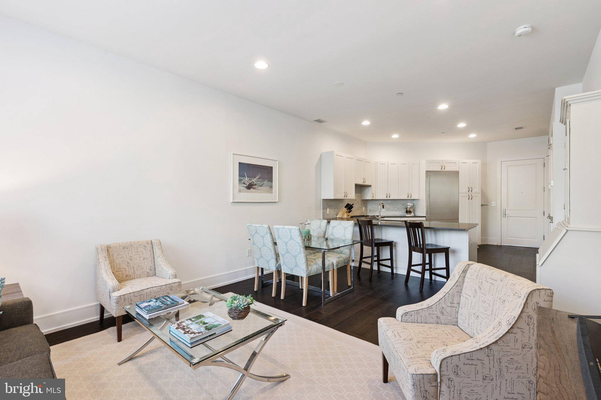 410 South Front Street, Unit 108 Philadelphia, PA 19147 - Photo 6 of 34 a living room with furniture and kitchen view