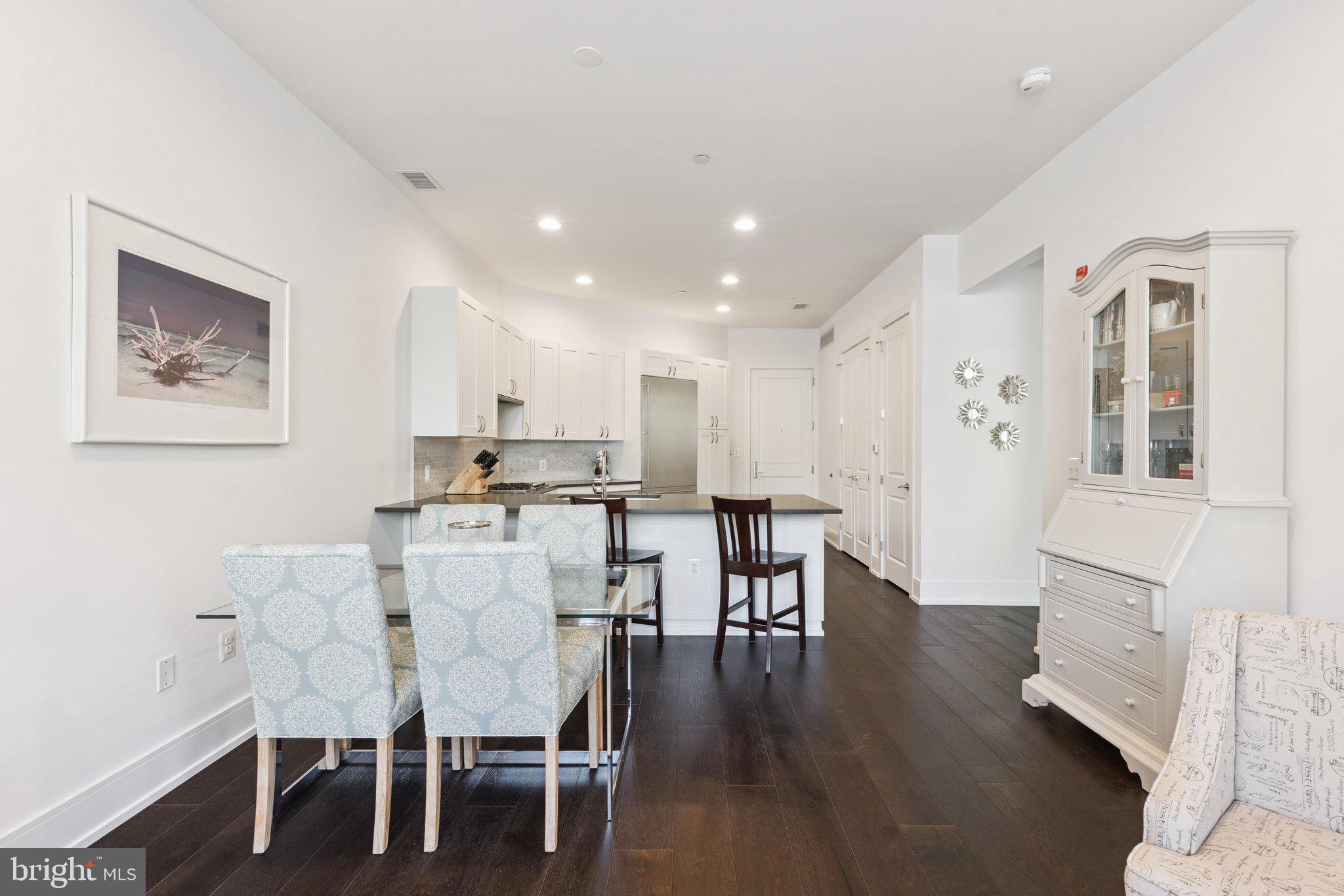 410 South Front Street, Unit 108 Philadelphia, PA 19147 - Photo 7 of 34 a view of a dining room with furniture and wooden floor
