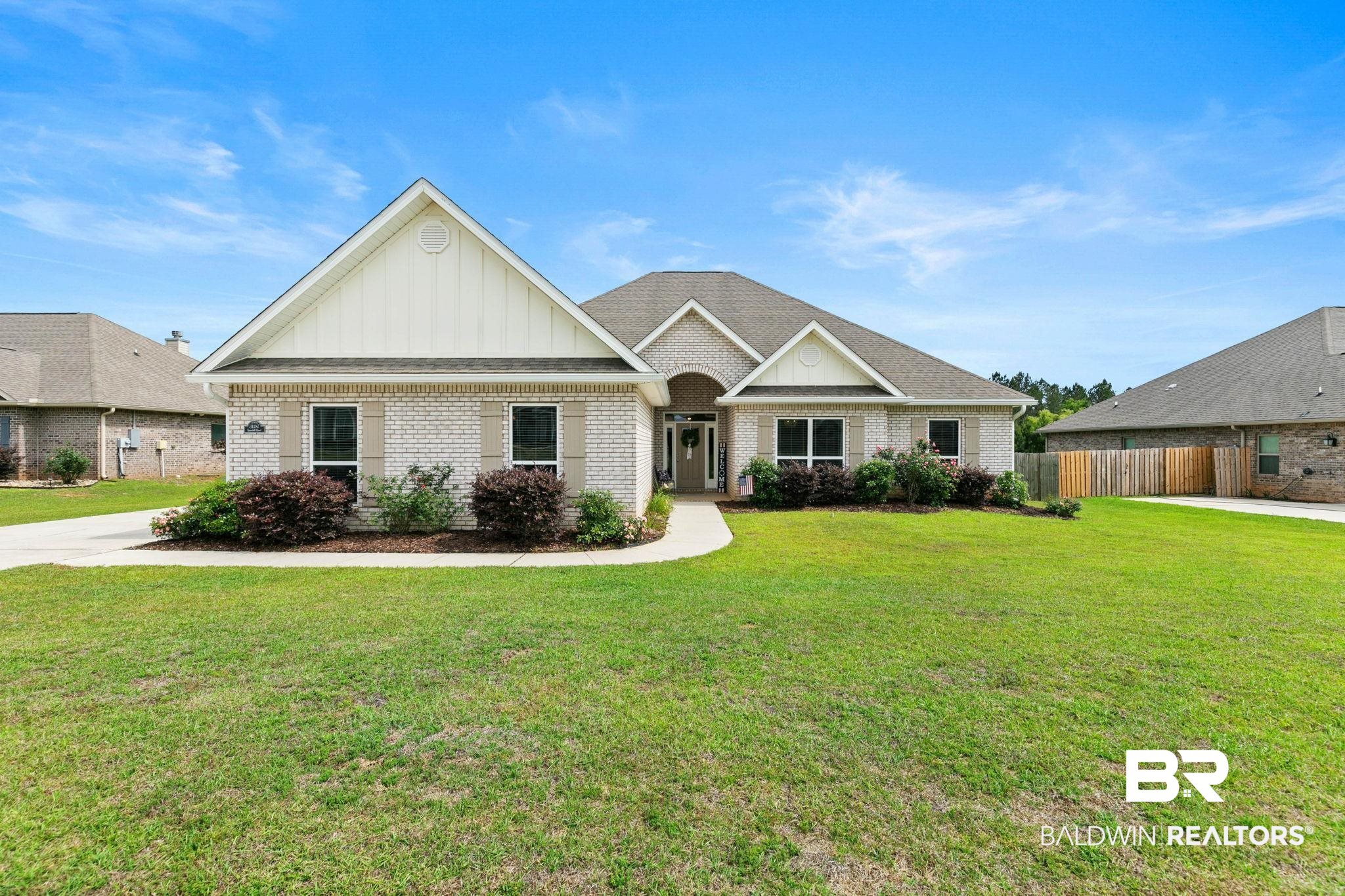 31187 Spoonbill Road Daphne, AL 36527 - Photo 1 of 85 Light brick exterior featuring gabled rooflines, decorative shutters, and a covered entry