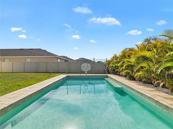 a view of swimming pool with a yard