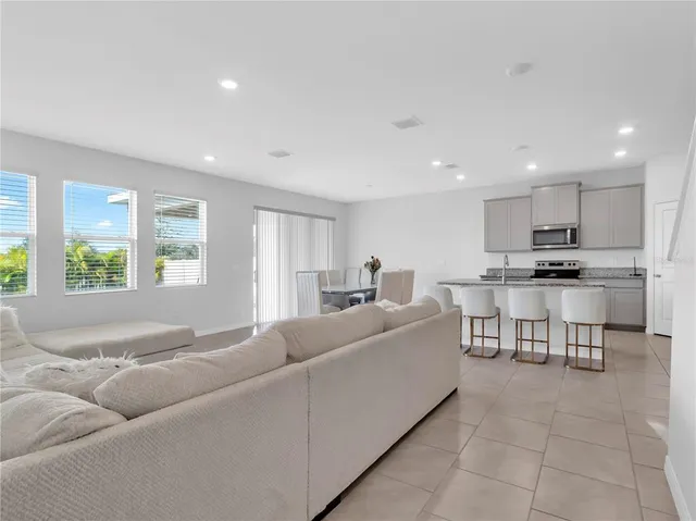 a bedroom with a bed and hallway